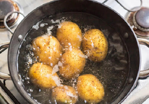 Tips on Sticking to a grocery shopping budget | Canadian Free Stuff boiling-potatoe | Tips on Sticking to a grocery shopping budget